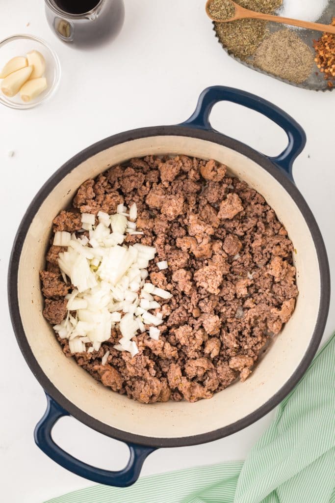 ground beef cooked with onions in a dutch oven