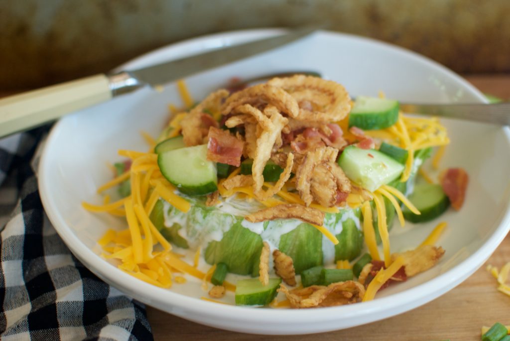 Easy wedge salad recipe with bacon, cheese, fried onions, and ranch dressing.