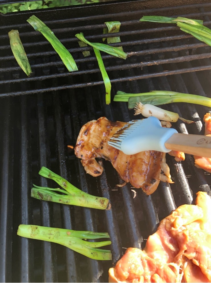 glazing chicken on the grill
