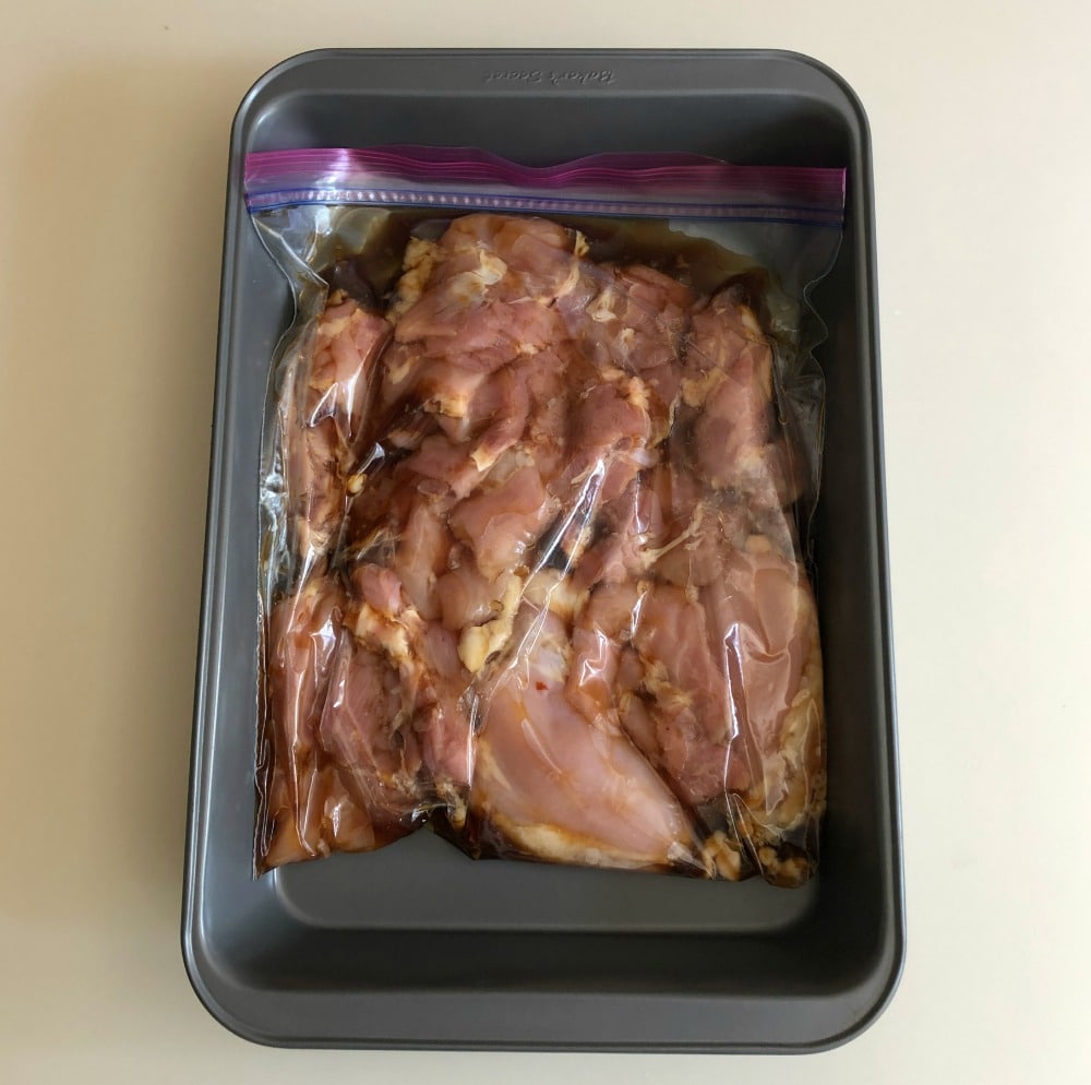 chicken marinading in a bag