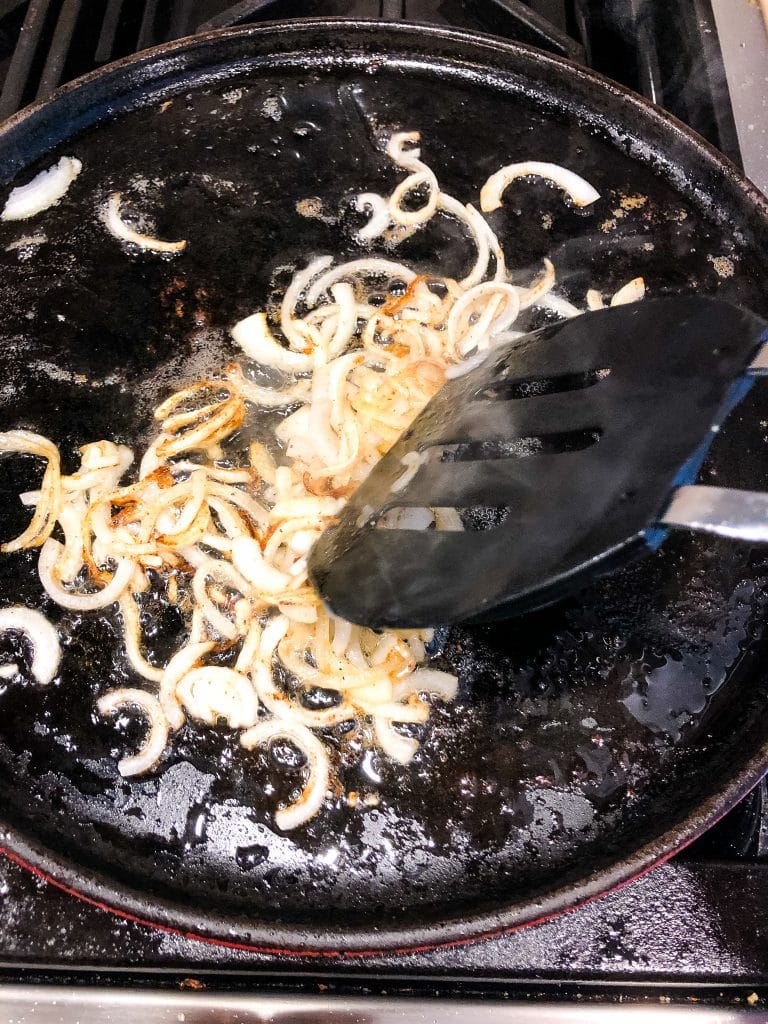 browned onions in a skillet for patty melts