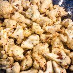 cauliflower with spices ready to be roasted