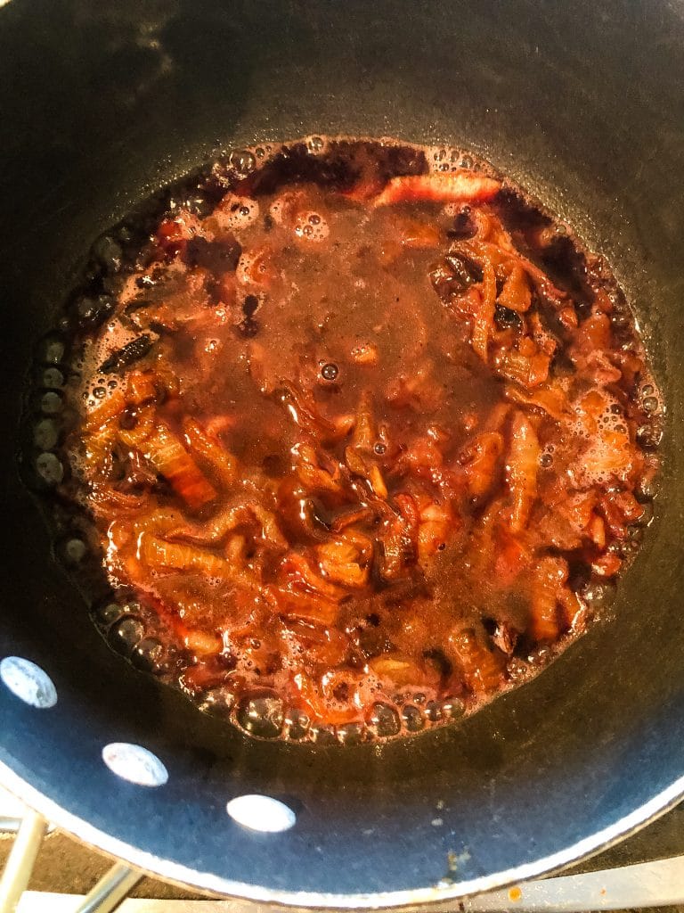 Red wine and onions in a pot