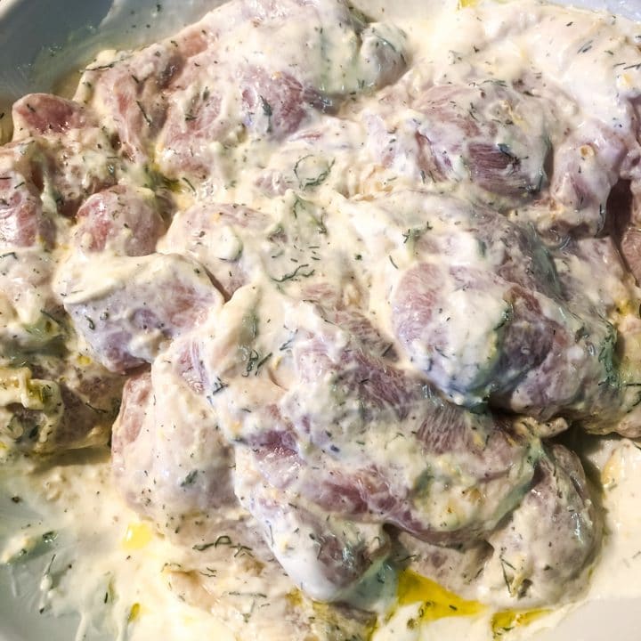 Chicken Thighs marinating in sour cream dip