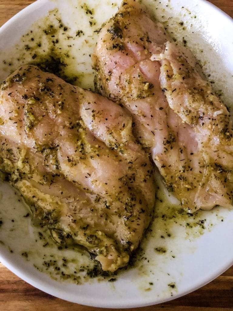 Chicken Breasts Marinating in Pesto