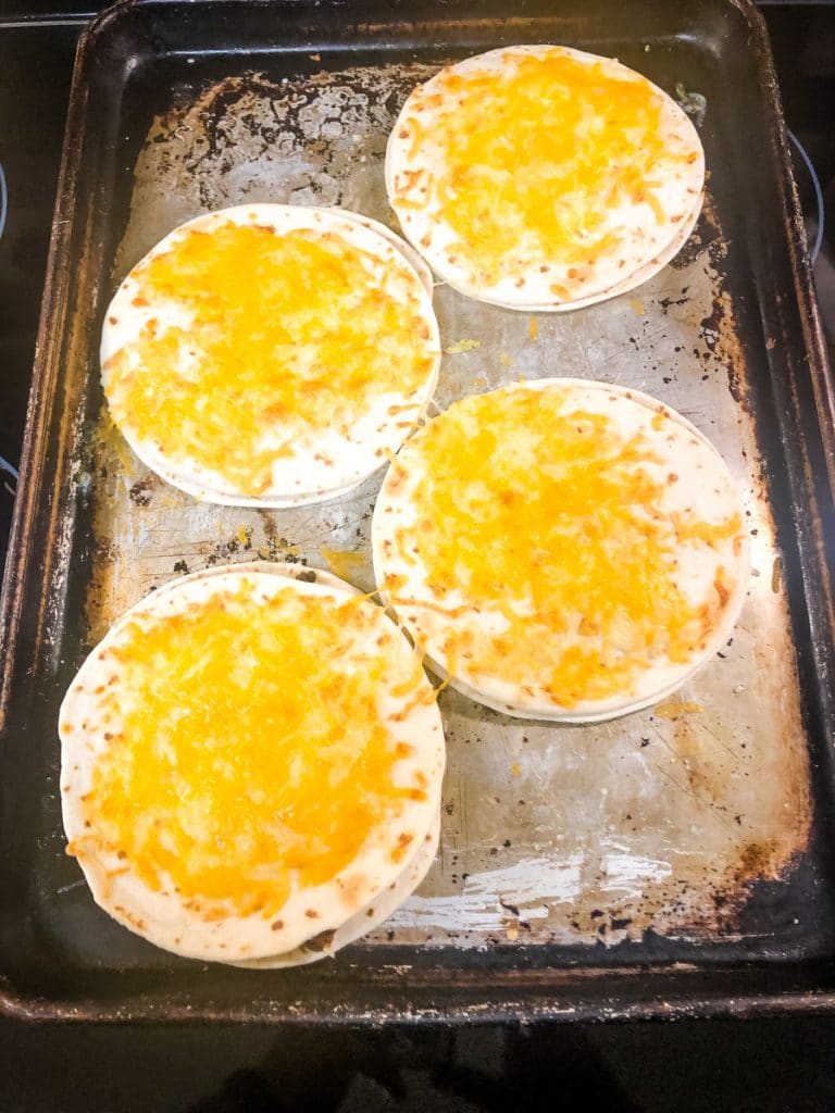 mexican pizzas with broiled cheese on top
