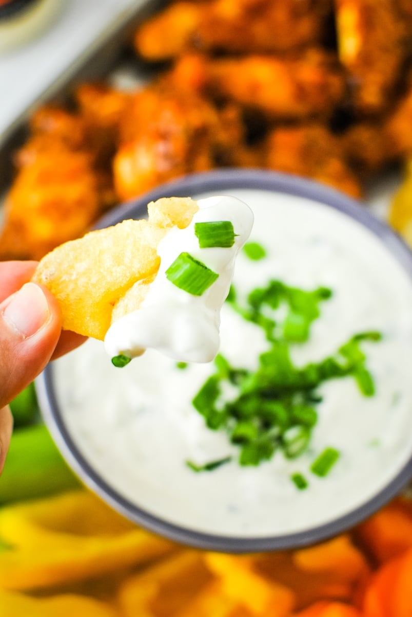 Dipping a Chip in Green Onion Dip