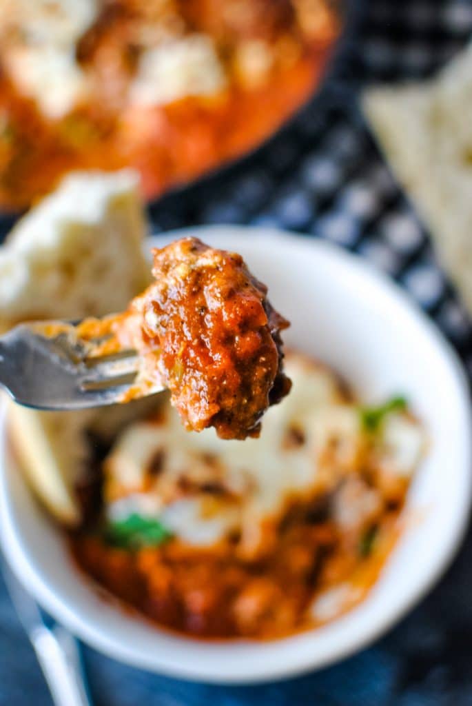 meatball in red sauce on a fork