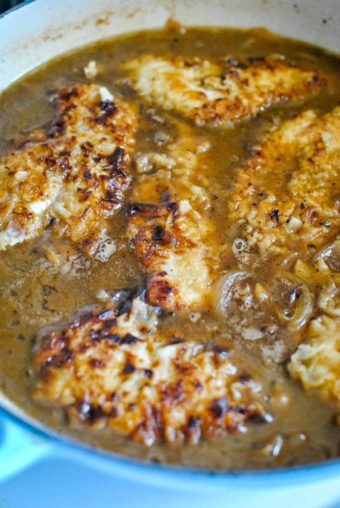 smothered southern chicken in a dutch oven braiser pot by le creuset