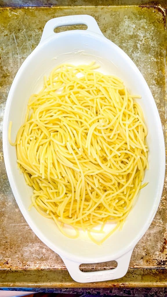 cooked spaghetti noodles in a baking dish