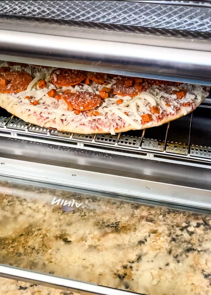 frozen pizza on Ninja Foodi Air Fryer Oven wire rack