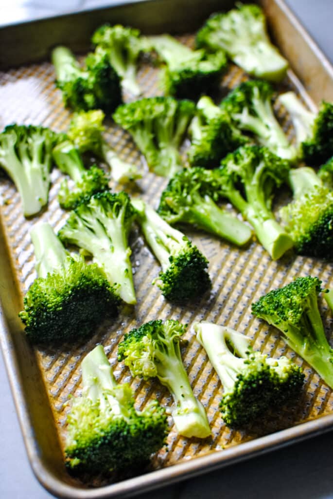 cut broccoli ready to be roasted