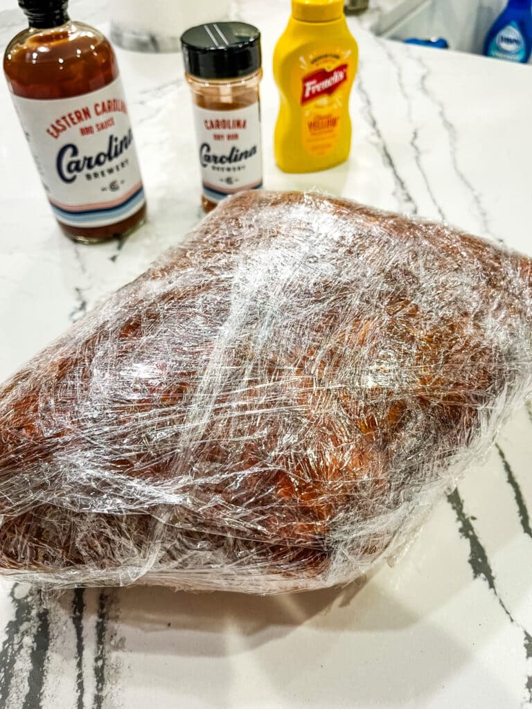 wrapping pork shoulder in plastic wrap