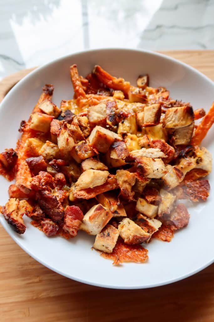 cheesy chicken over sweet potato fries