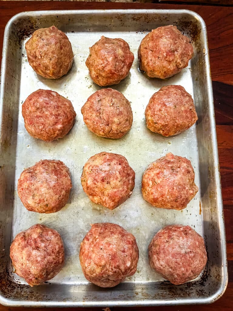 meatballs on a sheet pan ready for the oven