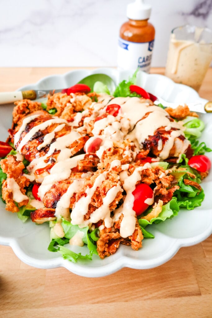 barbecue chicken salad with crispy onion strings