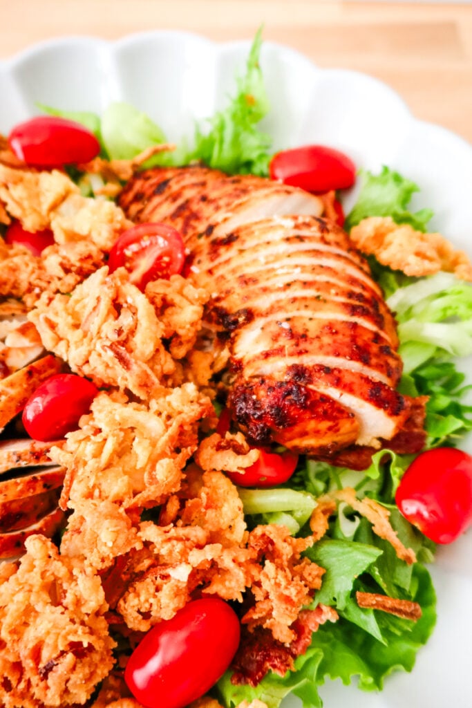 Crispy Onion Strings on a BBQ Chicken Salad