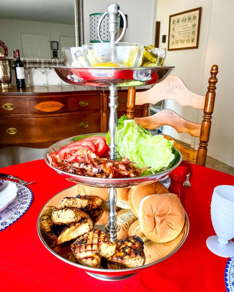 Stacked grilled chicken sandwiches on a platter for game day parties