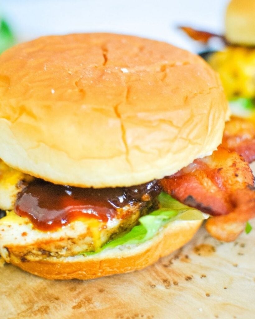 Monterey chicken sandwiches with grilled chicken, melted cheese, crispy bacon, and barbecue sauce on toasted buns