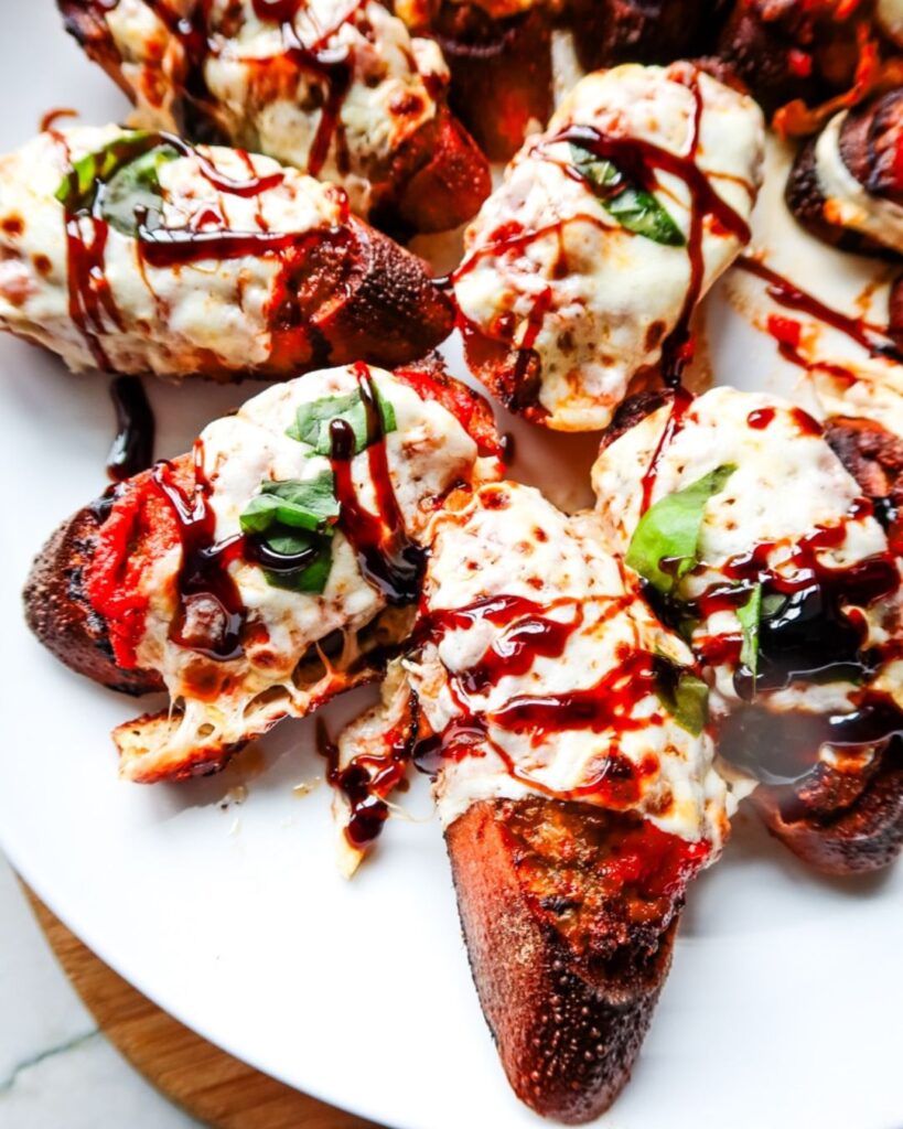 Mini toast rounds topped with meatballs and melted cheese.