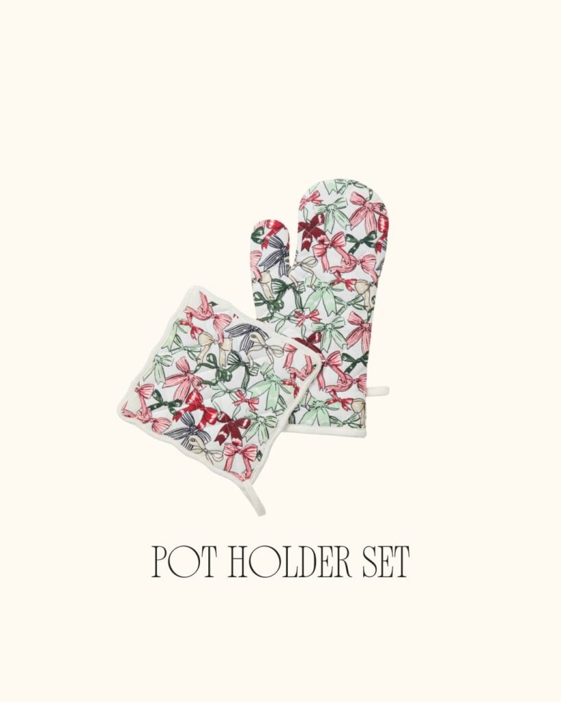 Floral and bow-patterned oven mitt and pot holder set on a cream background.