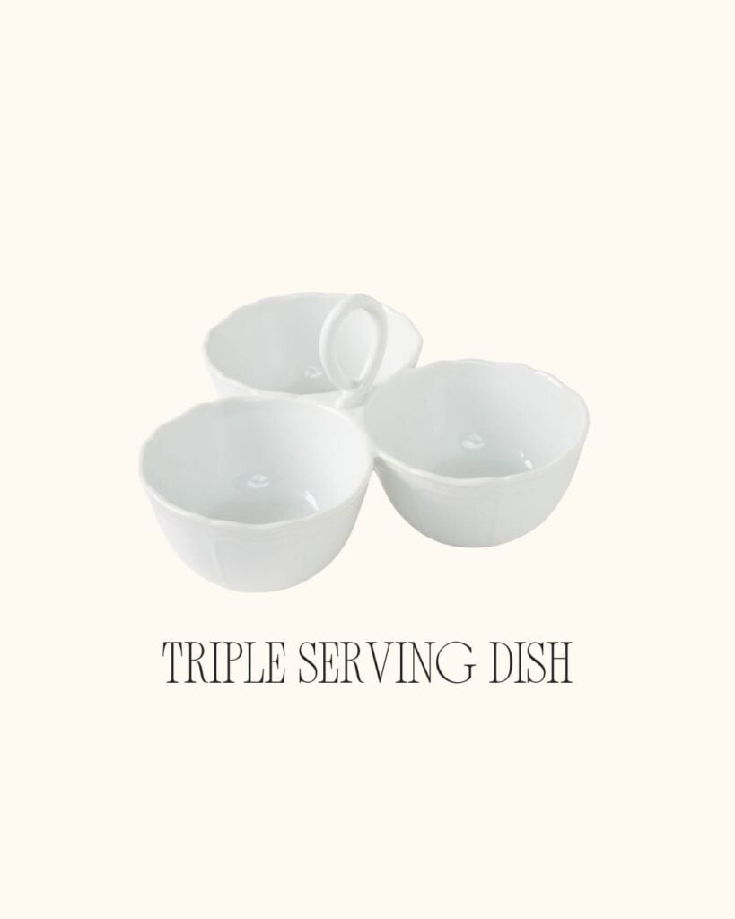 White triple-section serving bowl with a center handle, displayed on a neutral background.