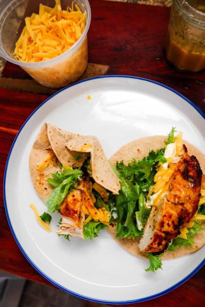 Air Fryer Chicken Snack Wrap with lettuce, cheddar cheese, and honey Dijon dressing.