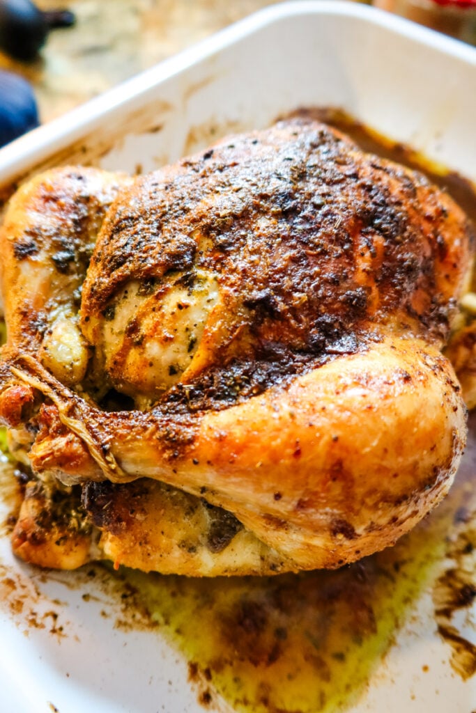 Close-up of Thanksgiving Butternaise Chicken showing crispy golden brown skin and herbs.