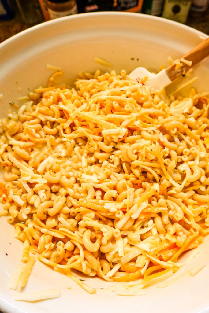 macaroni and cheese waiting to be added to a casserole dish