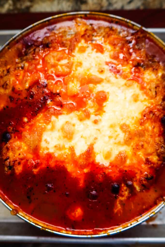 baked lasagna soup made with bolognese sauce, radiatori pasta, ricotta, and melted mozzarella.
